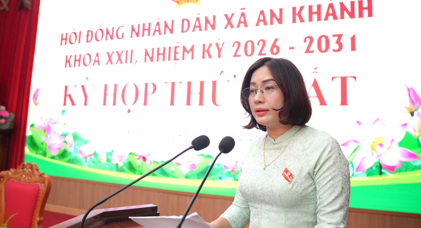 A person standing at a podium with microphones  AI-generated content may be incorrect.