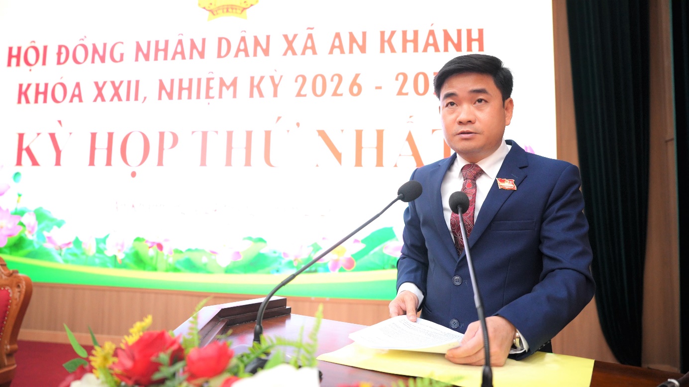 A person in a suit standing at a podium with a microphone  AI-generated content may be incorrect.