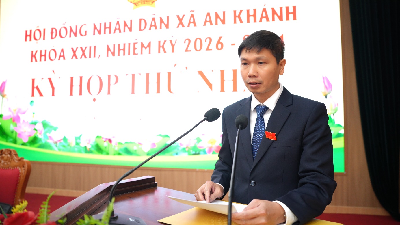 A person in a suit and tie standing at a podium  AI-generated content may be incorrect.