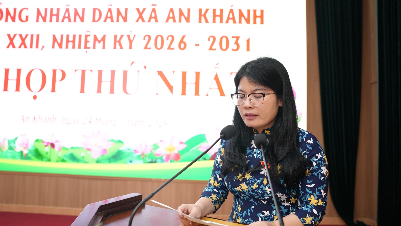 A person standing at a podium with microphones  AI-generated content may be incorrect.