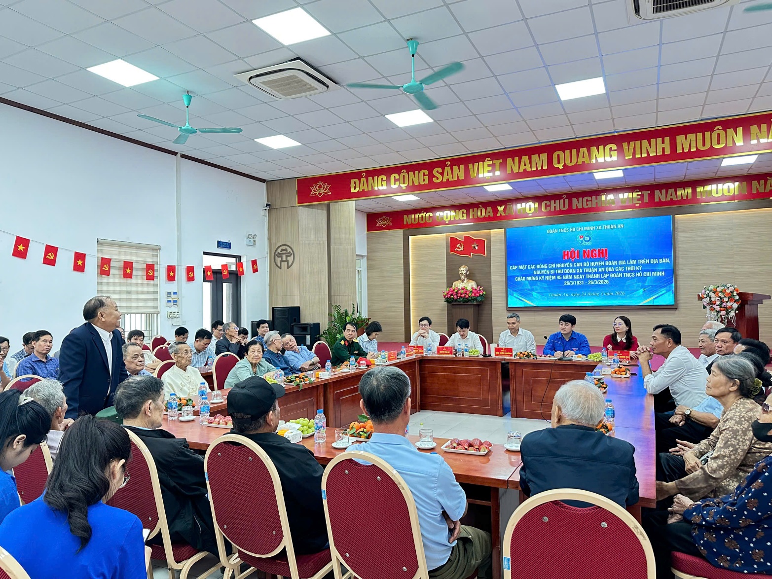 A group of people sitting at a table  AI-generated content may be incorrect.