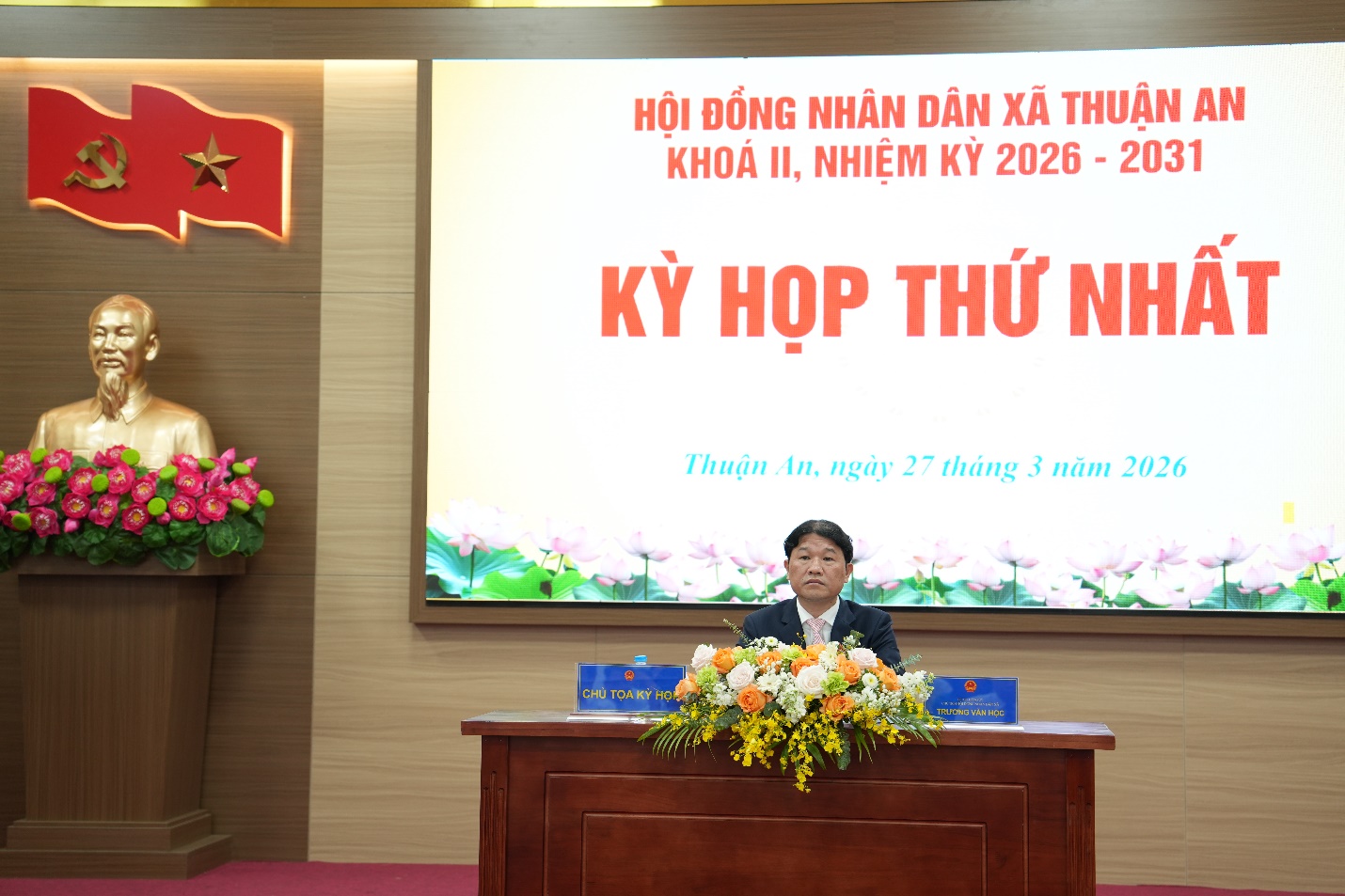 A person sitting at a desk with flowers  AI-generated content may be incorrect.