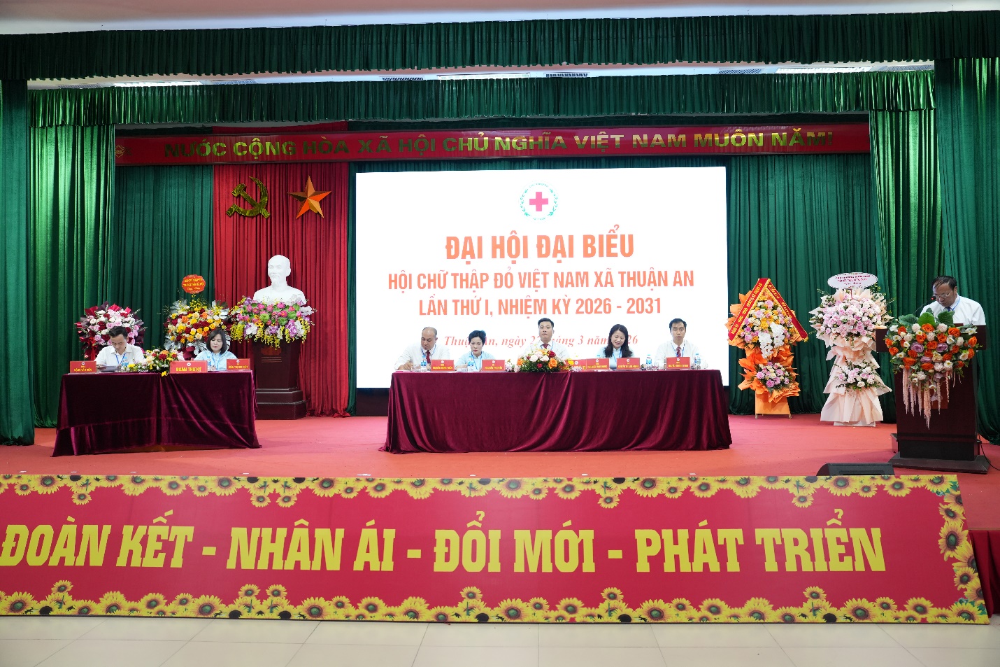 A group of people sitting at a table  AI-generated content may be incorrect.