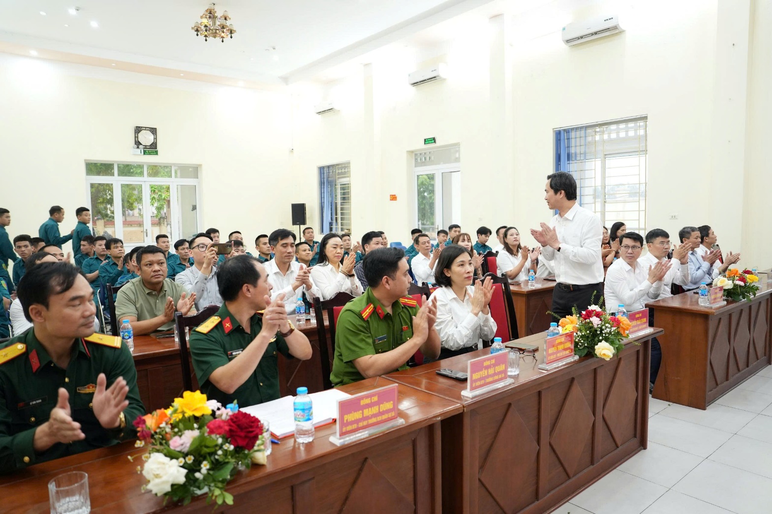 A group of people in a room  AI-generated content may be incorrect.