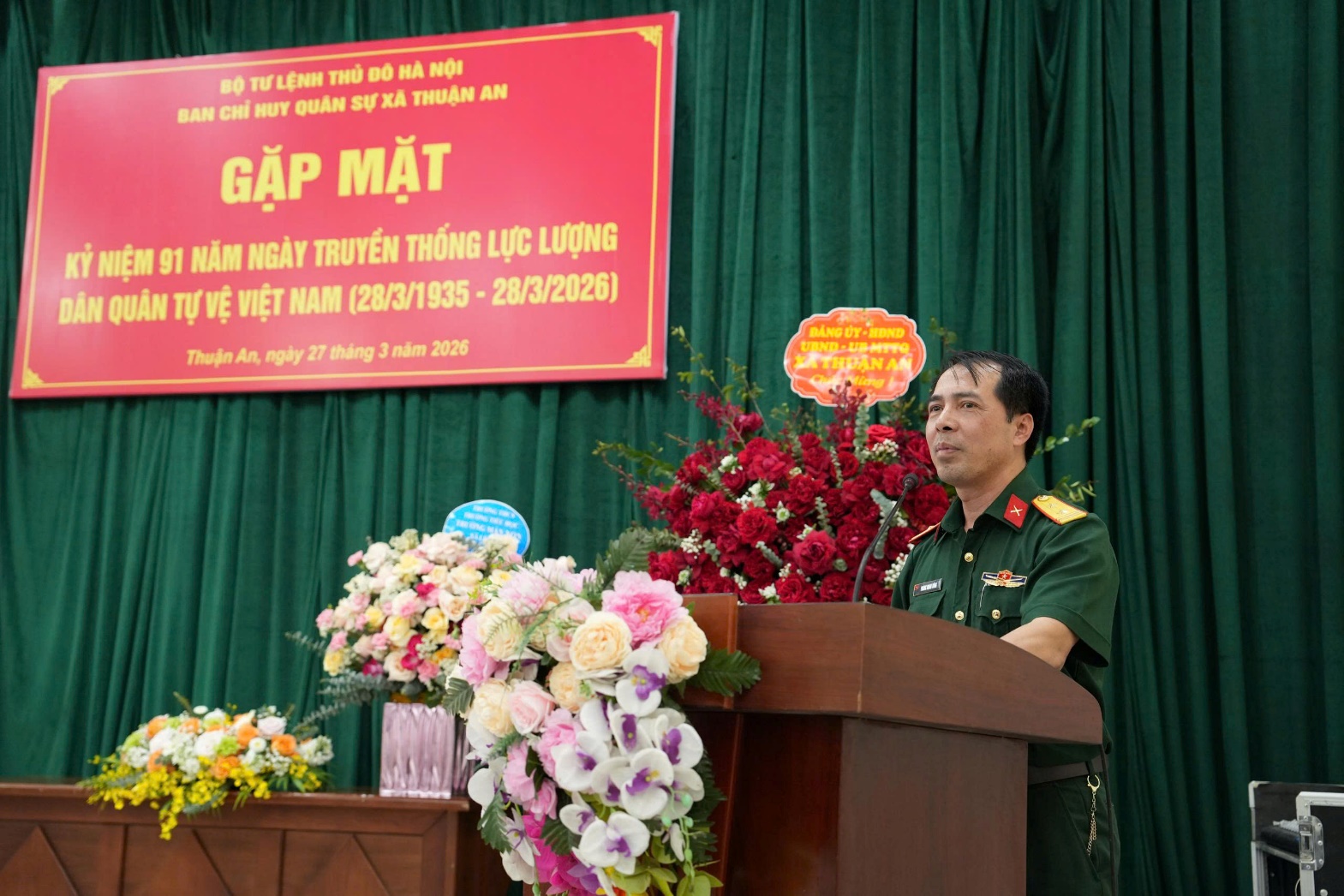 A person standing at a podium with flowers  AI-generated content may be incorrect.