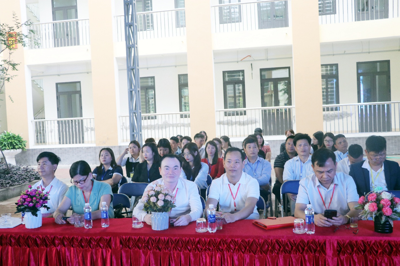 A group of people sitting at a table  AI-generated content may be incorrect.