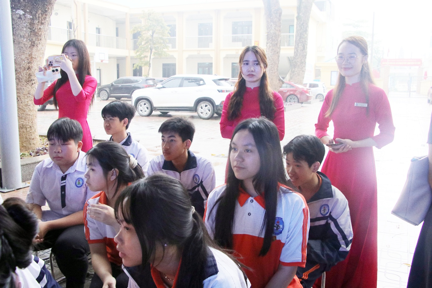 A group of people standing on a street  AI-generated content may be incorrect.