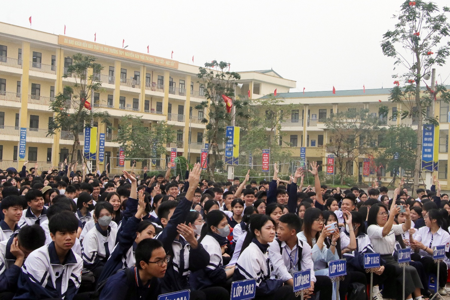 A group of people in uniform raising their hands  AI-generated content may be incorrect.