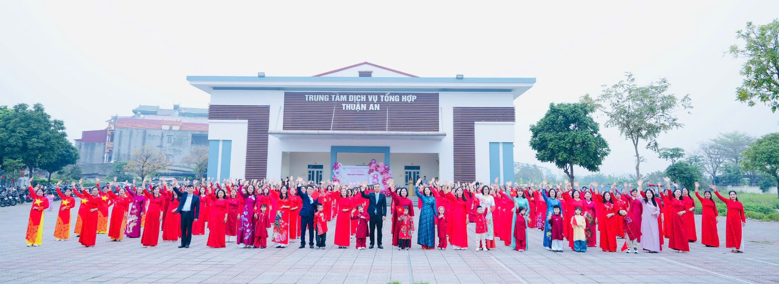 A group of people in red and pink dresses  AI-generated content may be incorrect.