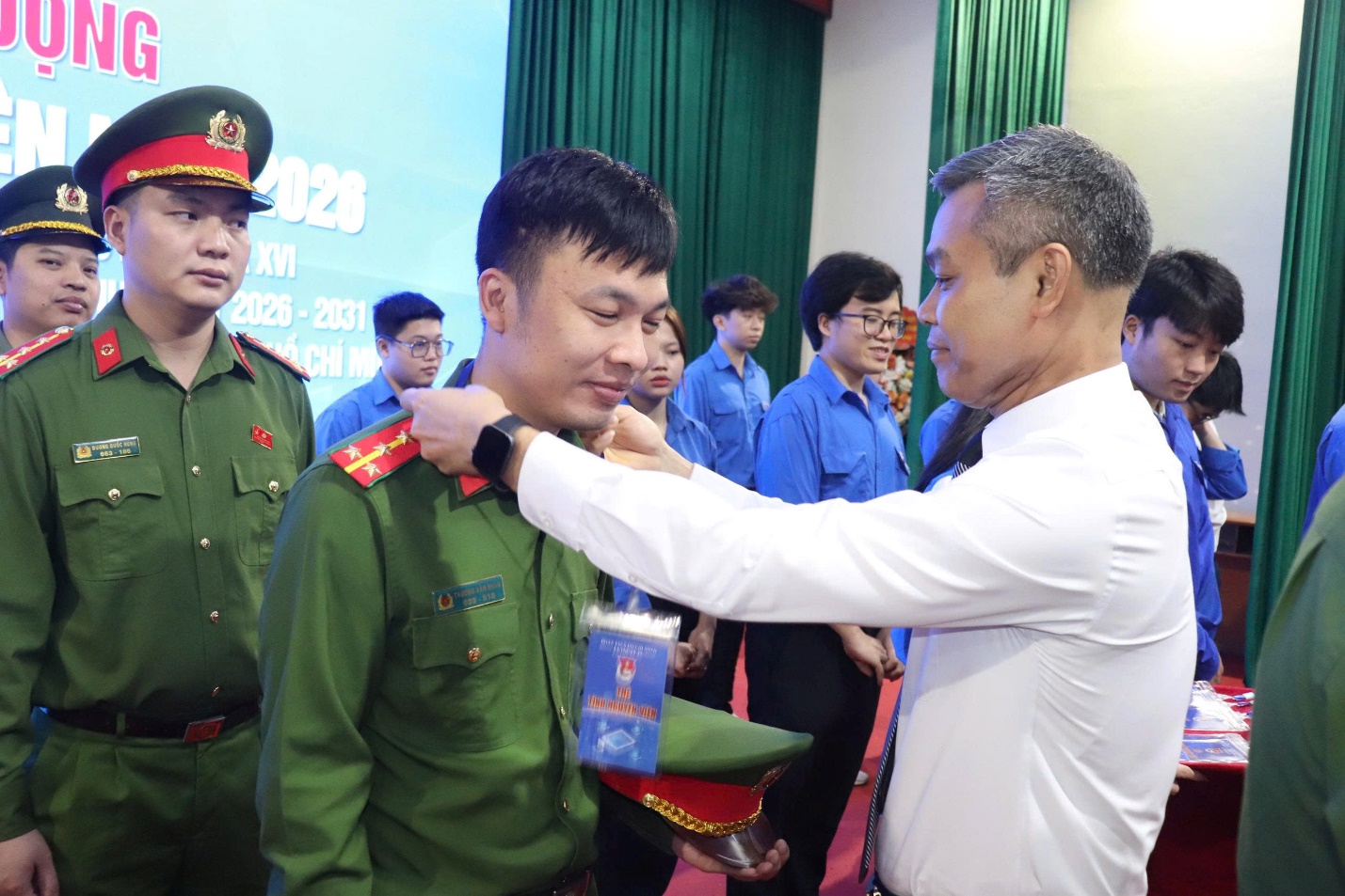 A person in a white shirt and green uniform  AI-generated content may be incorrect.