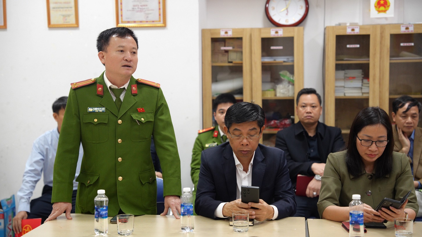 A person in a military uniform standing next to a group of people  AI-generated content may be incorrect.