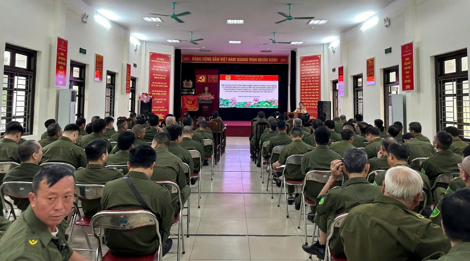 A group of people in a room  AI-generated content may be incorrect.