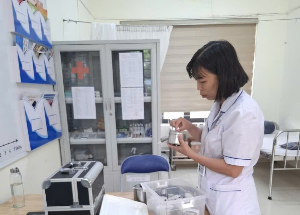 A person in a white coat holding a container  AI-generated content may be incorrect.