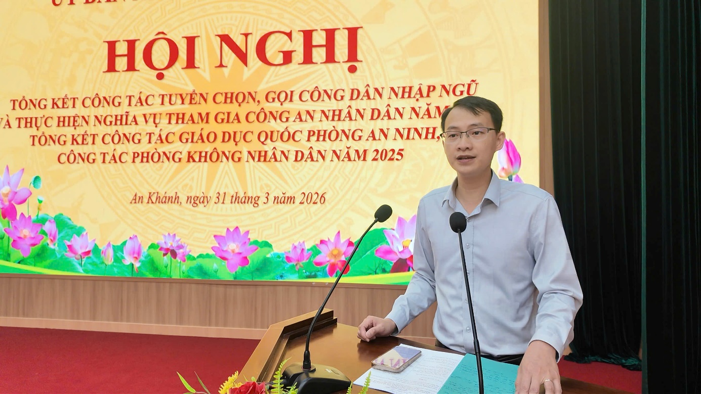 A person standing at a podium with microphones  AI-generated content may be incorrect.