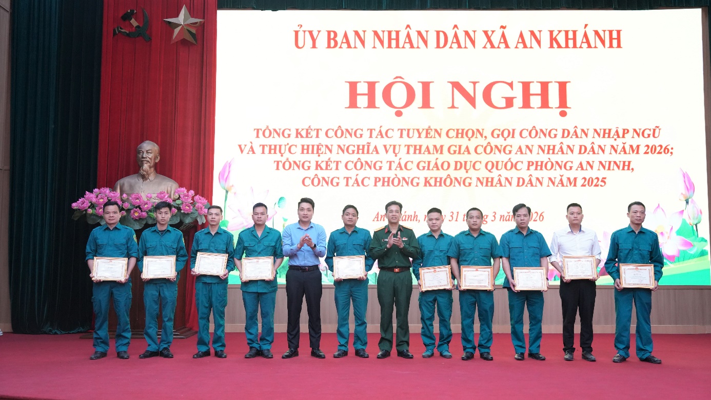 A group of people standing in front of a banner  AI-generated content may be incorrect.