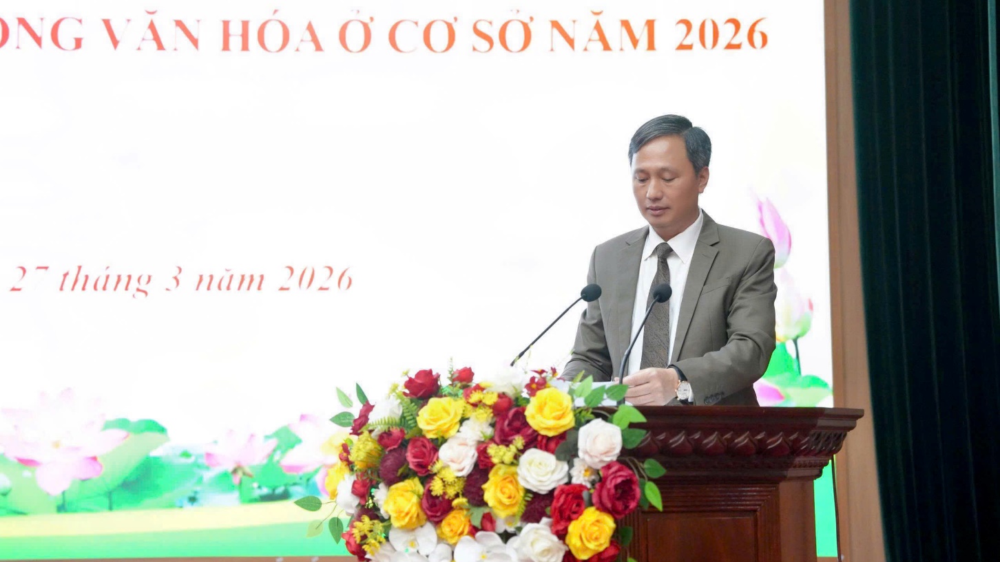 A person standing at a podium with a bunch of flowers  AI-generated content may be incorrect.