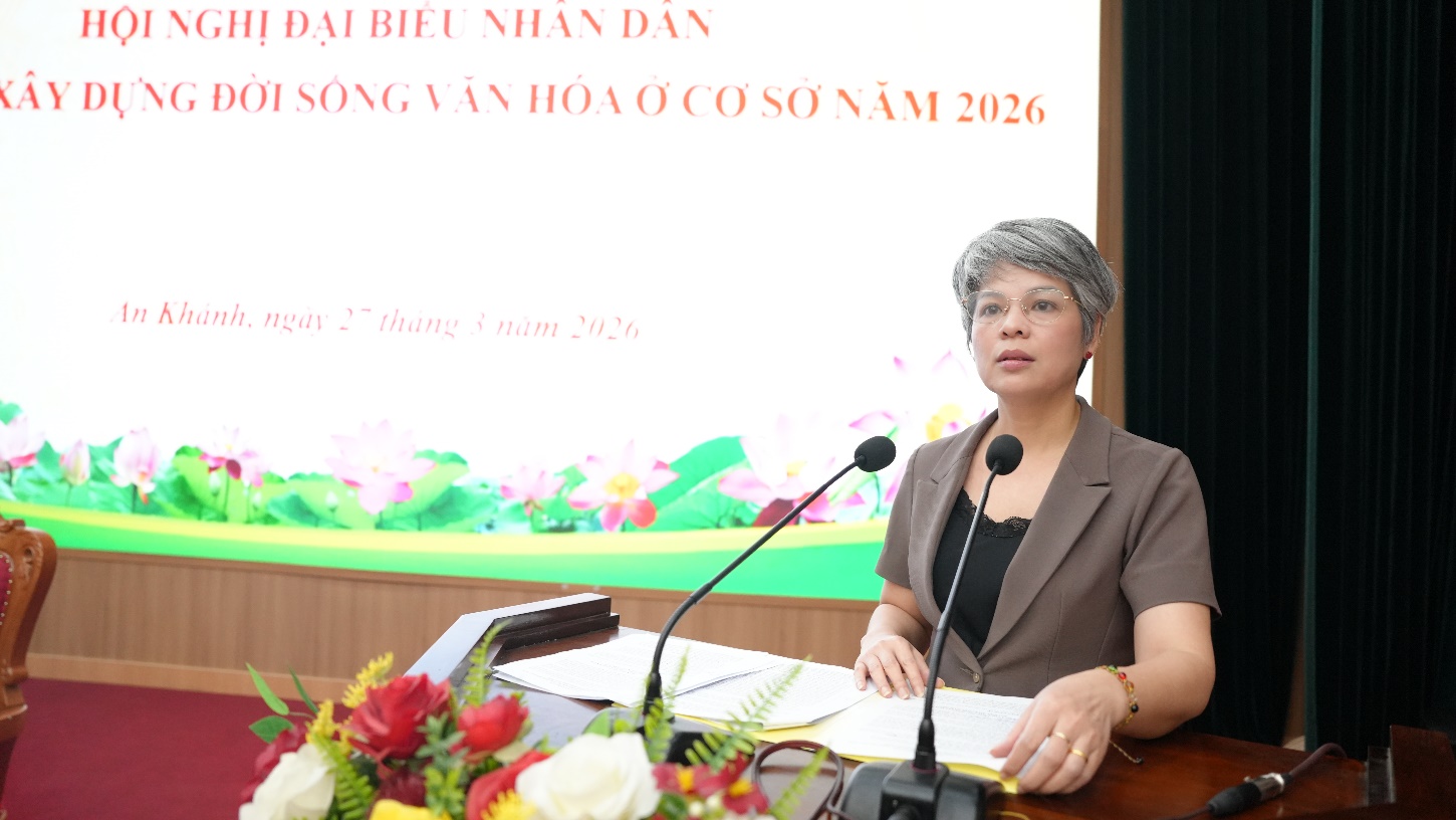 A person sitting at a podium with microphones  AI-generated content may be incorrect.