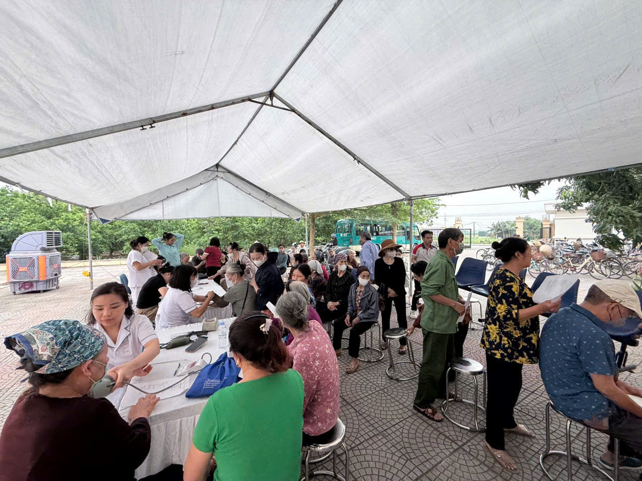 A group of people in a tent  AI-generated content may be incorrect.