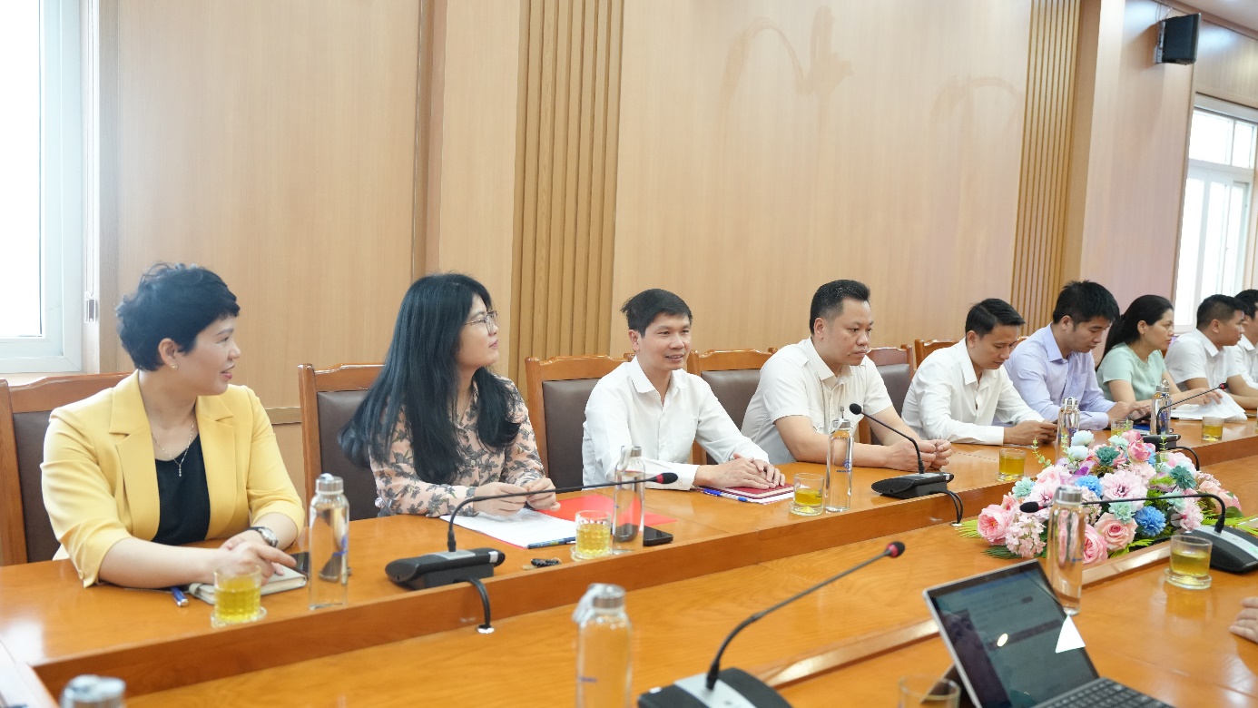 A group of people sitting at a table  AI-generated content may be incorrect.