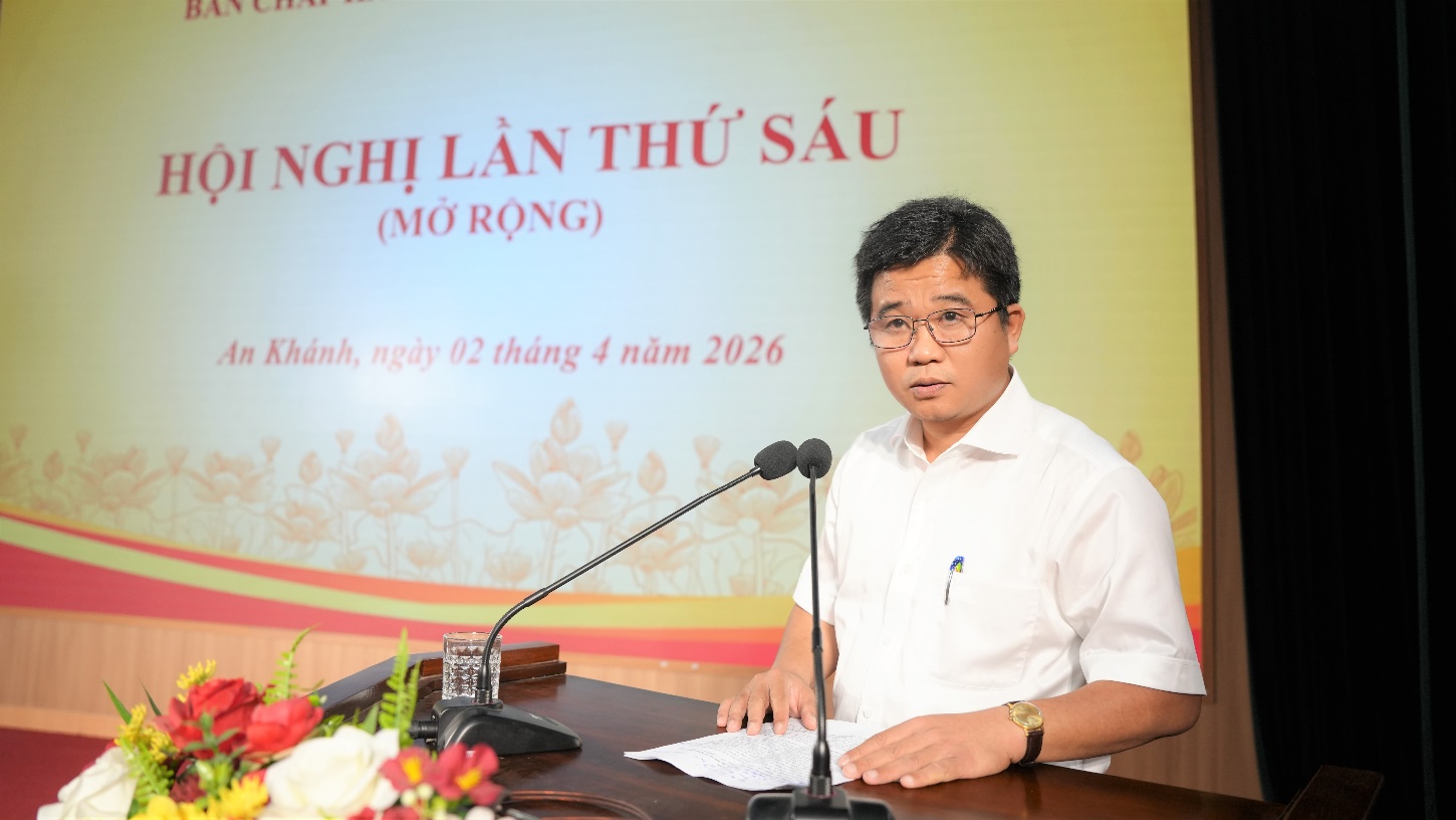 A person sitting at a desk with microphones  AI-generated content may be incorrect.