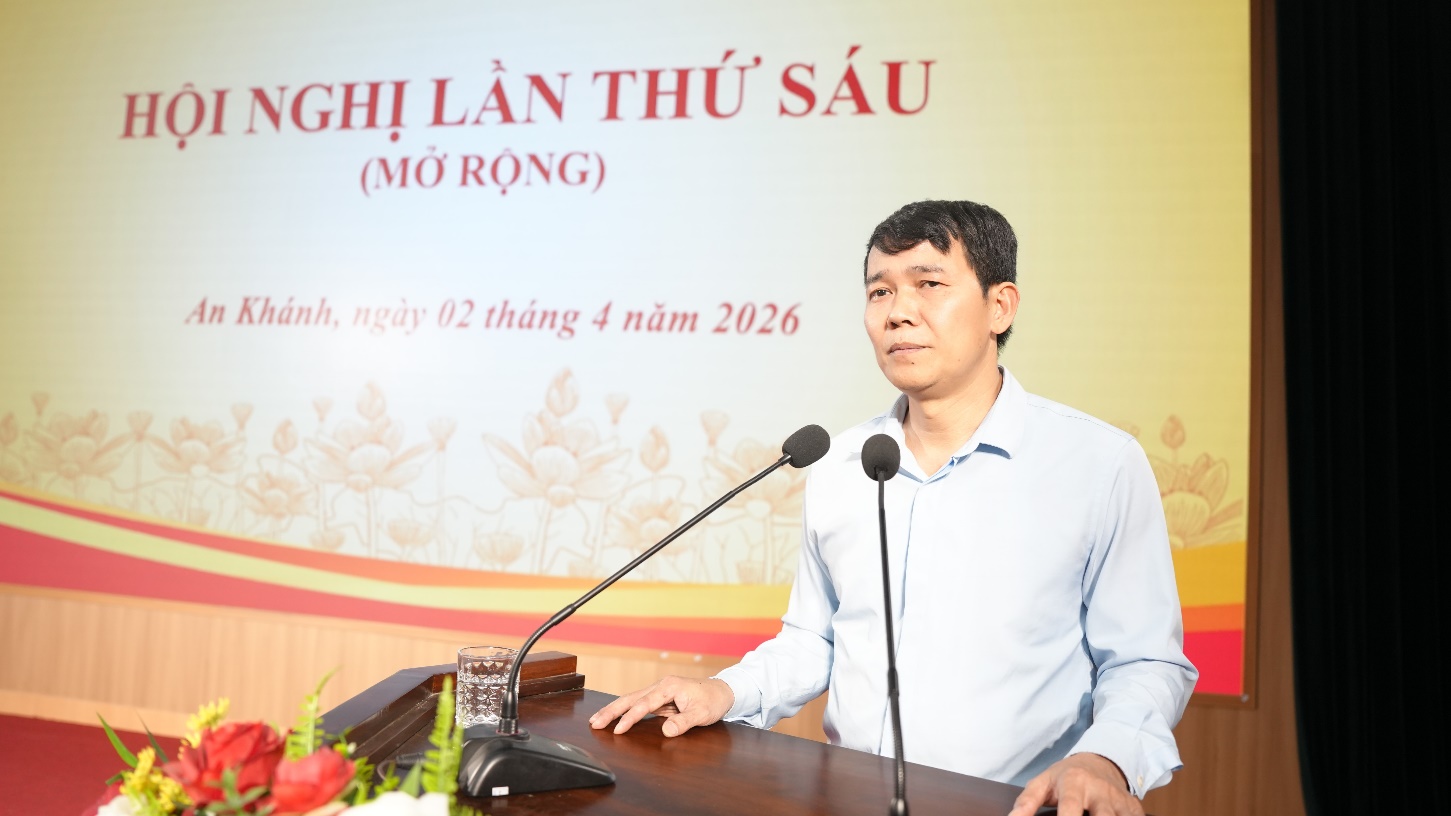 A person standing at a podium with microphones  AI-generated content may be incorrect.