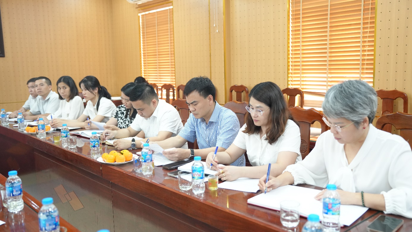 A group of people sitting at a table  AI-generated content may be incorrect.