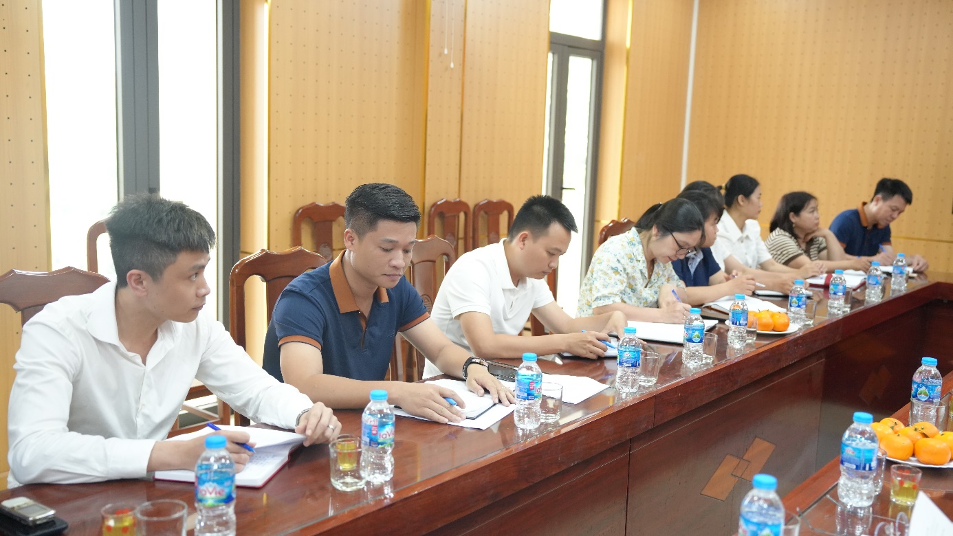 A group of people sitting at a table  AI-generated content may be incorrect.