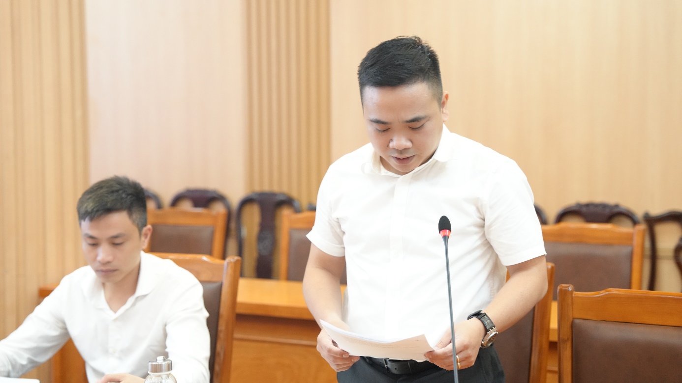 A person standing in front of a microphone  AI-generated content may be incorrect.