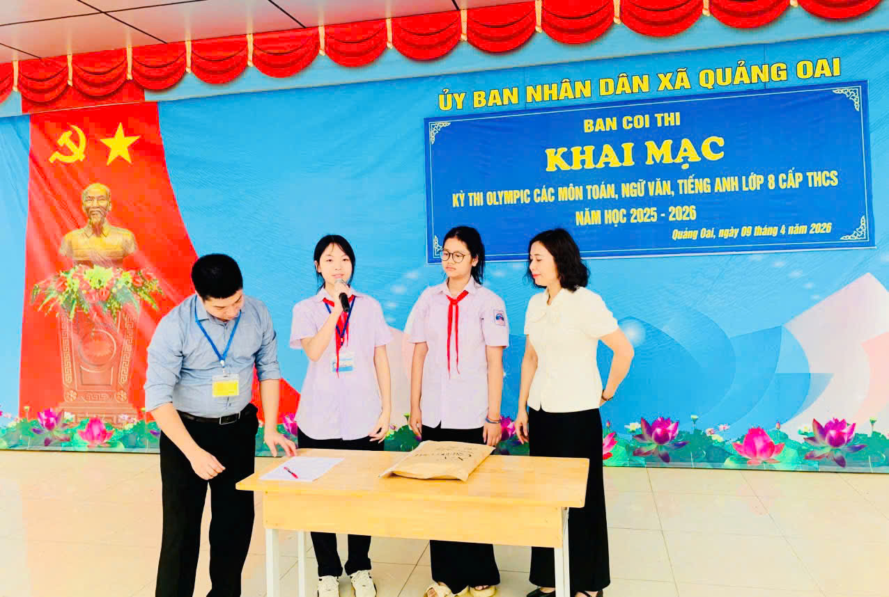 Có thể là hình ảnh về ‎một hoặc nhiều người và ‎văn bản cho biết '‎که ỦY BAN NHÂN DÂN XA QUÁNG OAI BAN COI THI KHAI MAC KY THI OLYMPIC CÁC MÔN TOÁN, NGỮ VĂN, TIẾNG ANH LỚP 8 CẤP THCS NÁM Hoc 2025 2026 Quang Oal, ngày 1200 năm 2026‎'‎‎