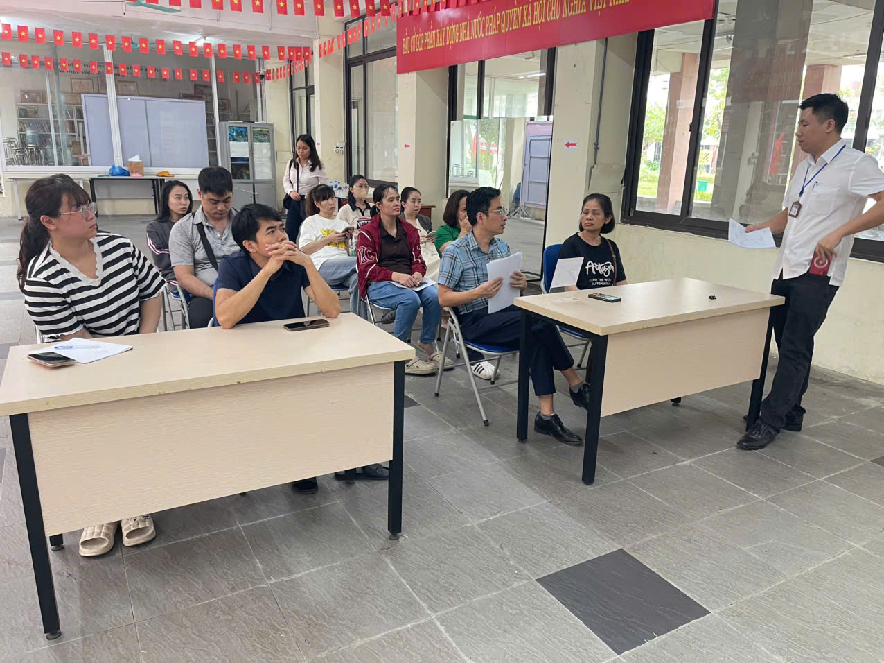 A group of people sitting in a room  AI-generated content may be incorrect.