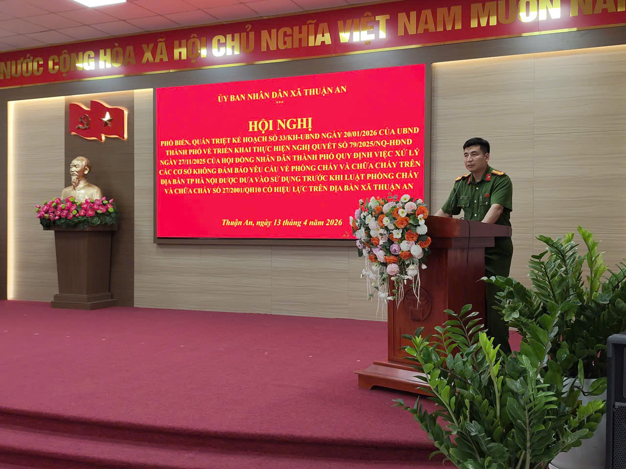 A person standing at a podium  AI-generated content may be incorrect.