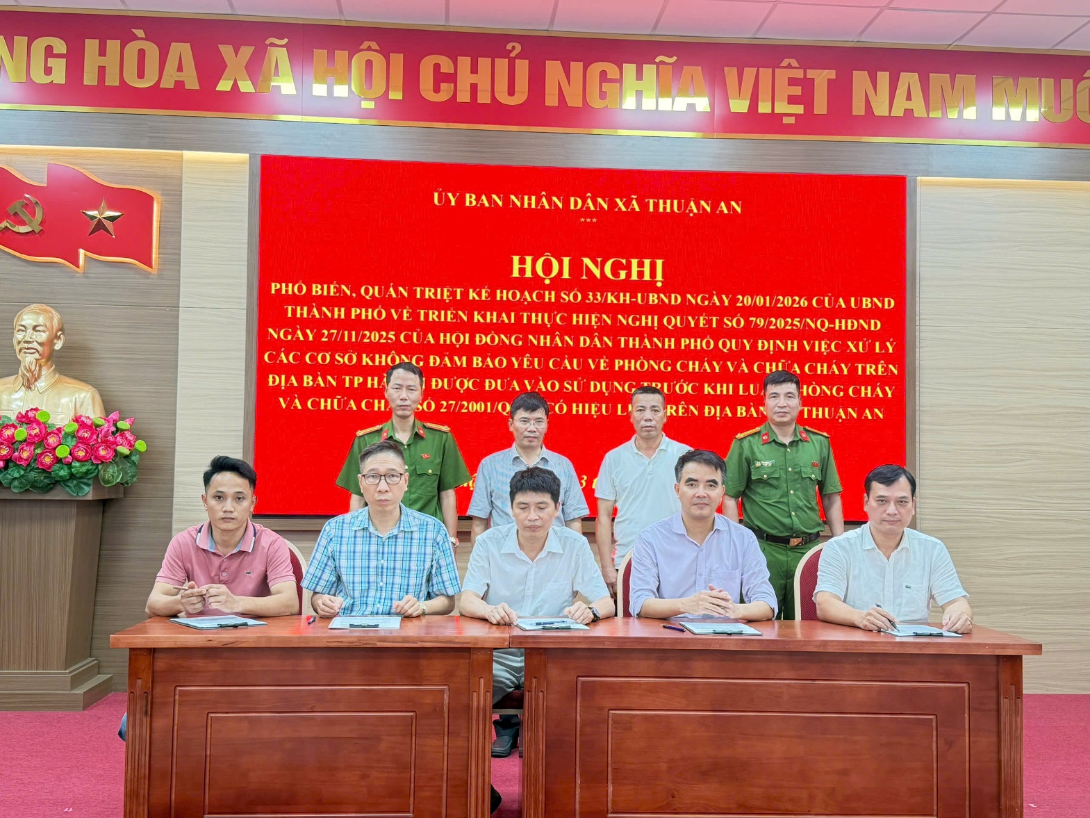 A group of people sitting at a table  AI-generated content may be incorrect.