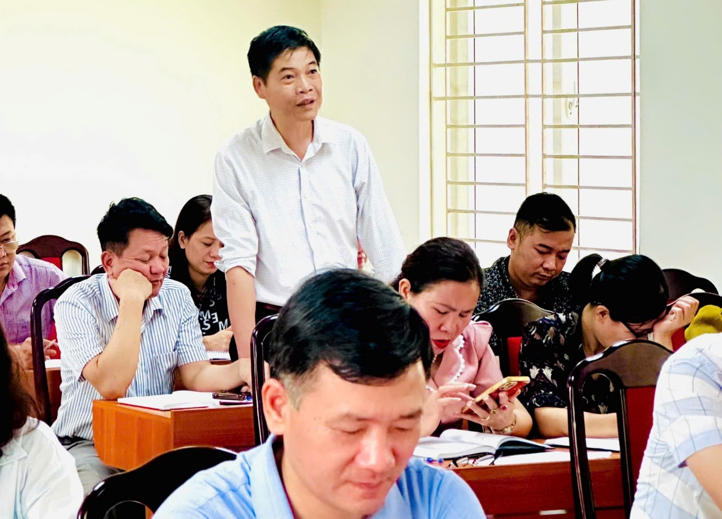 A group of people in a classroom  AI-generated content may be incorrect.