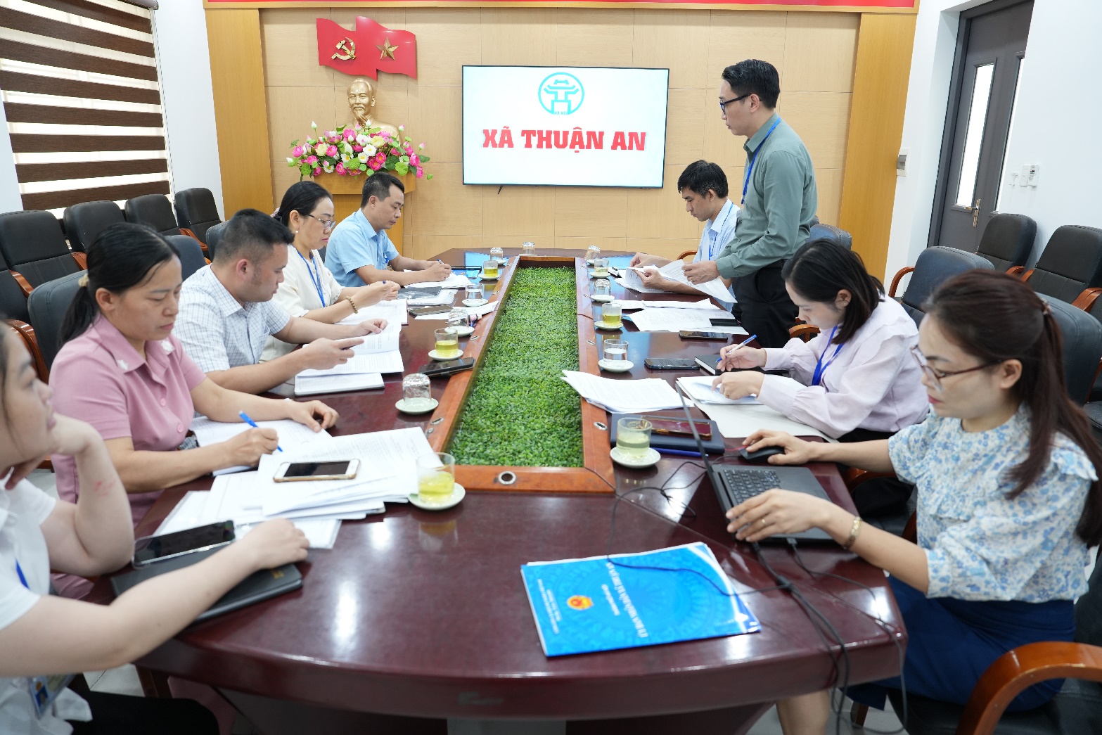 A group of people sitting around a table  AI-generated content may be incorrect.