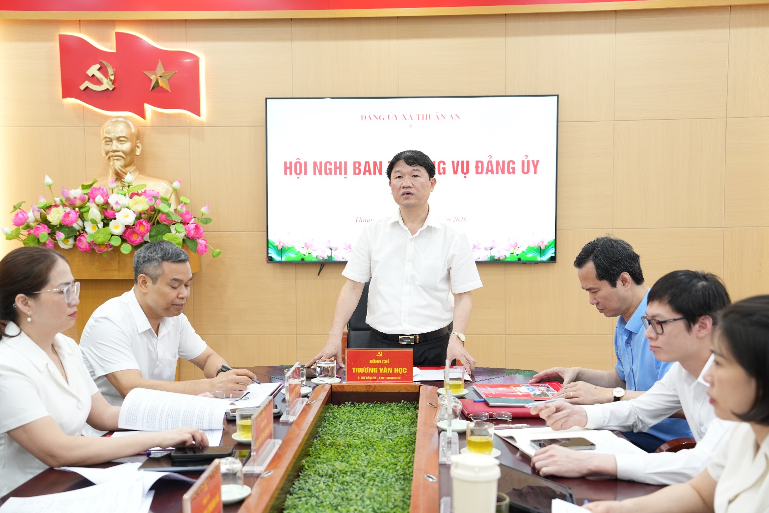 A group of people sitting around a table  AI-generated content may be incorrect.