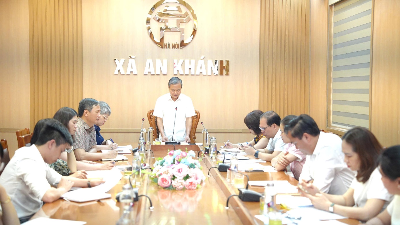 A person speaking at a meeting  AI-generated content may be incorrect.