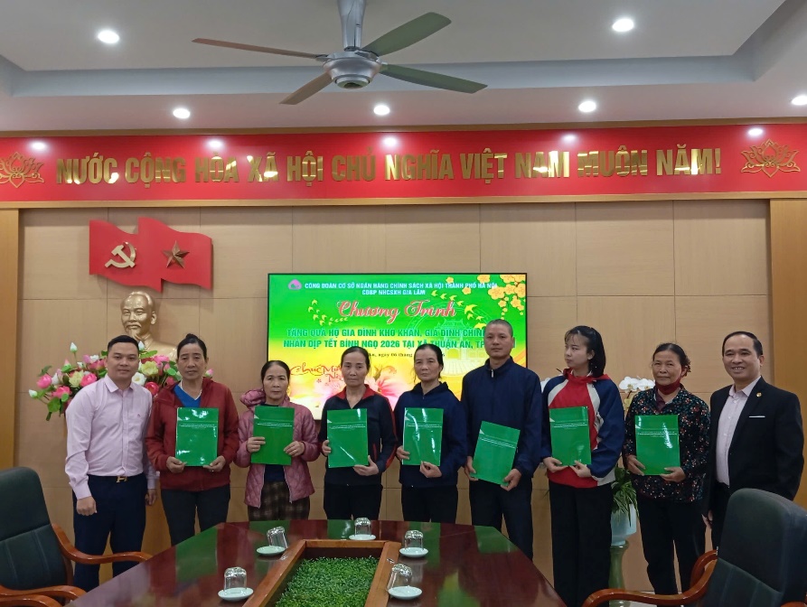 A group of people holding green papers  AI-generated content may be incorrect.