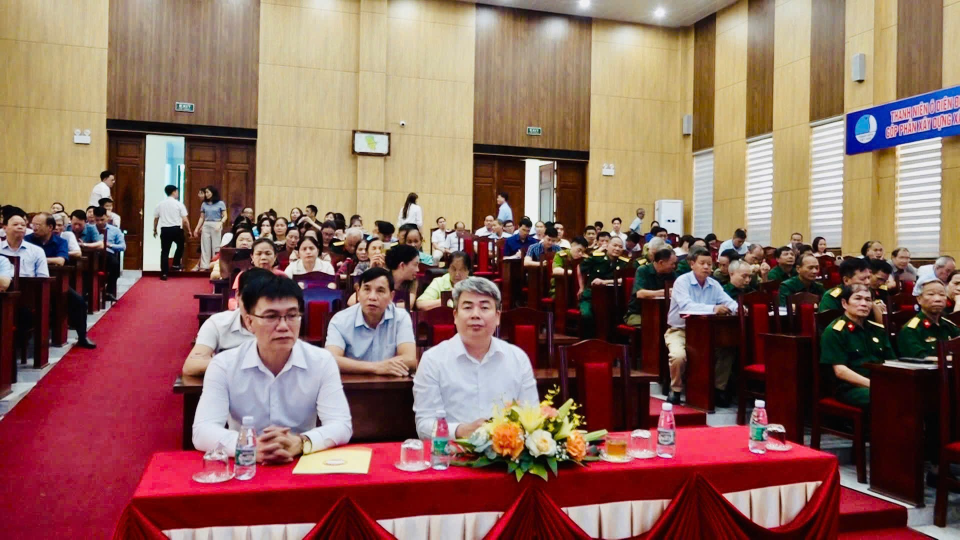 A group of people sitting at a table  Description automatically generated