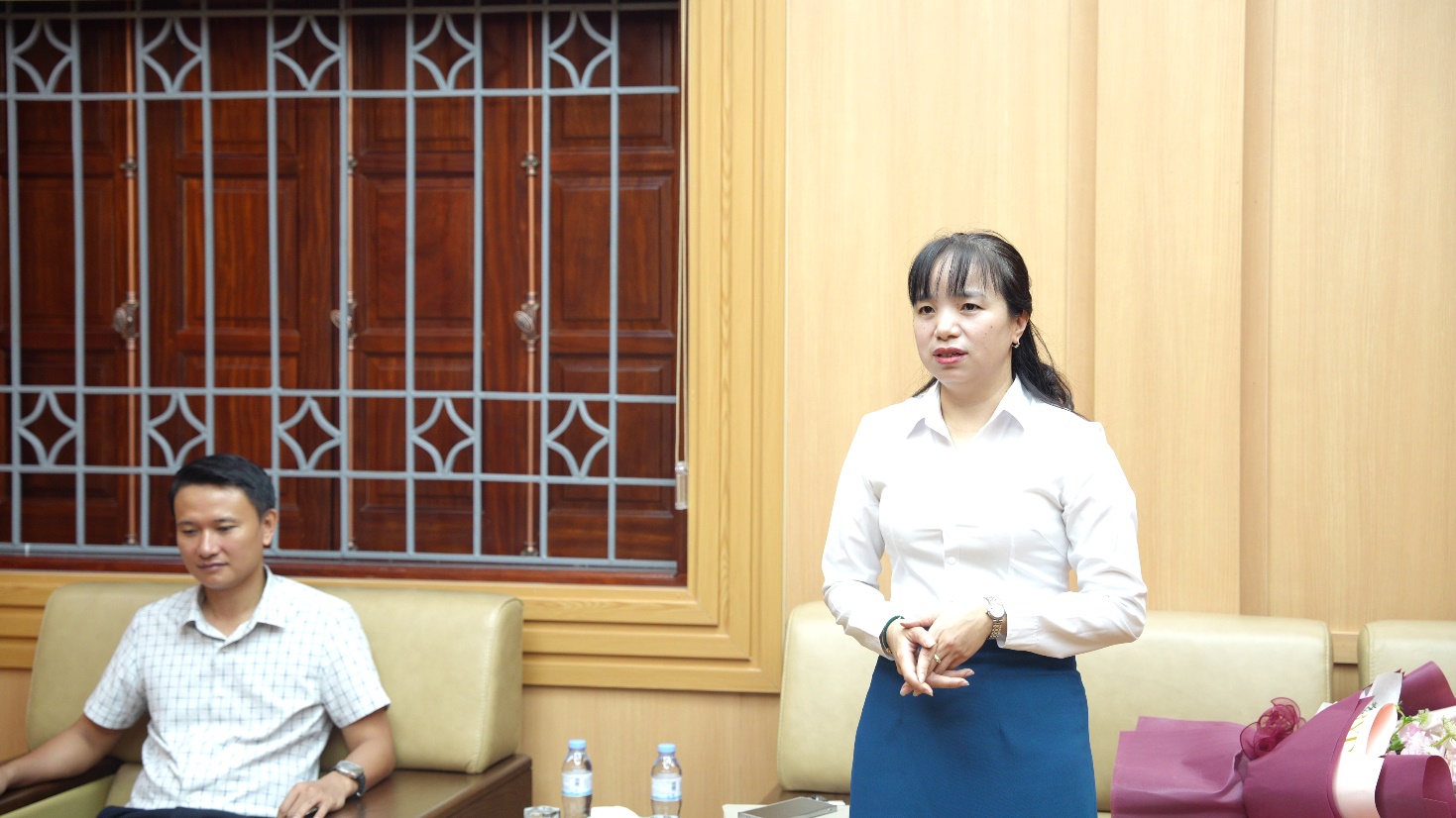 A person standing in front of a person  AI-generated content may be incorrect.