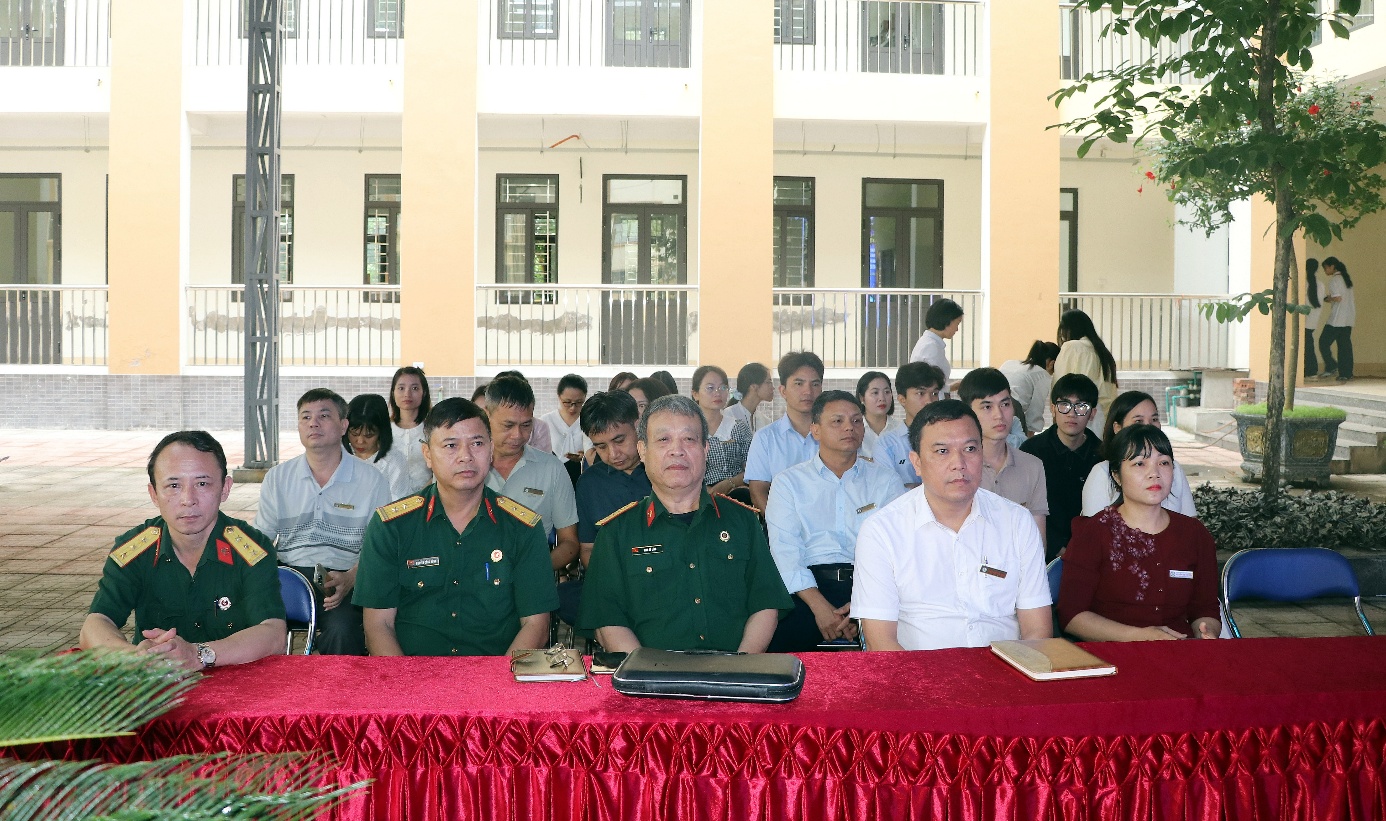 A group of people sitting at a table  AI-generated content may be incorrect.