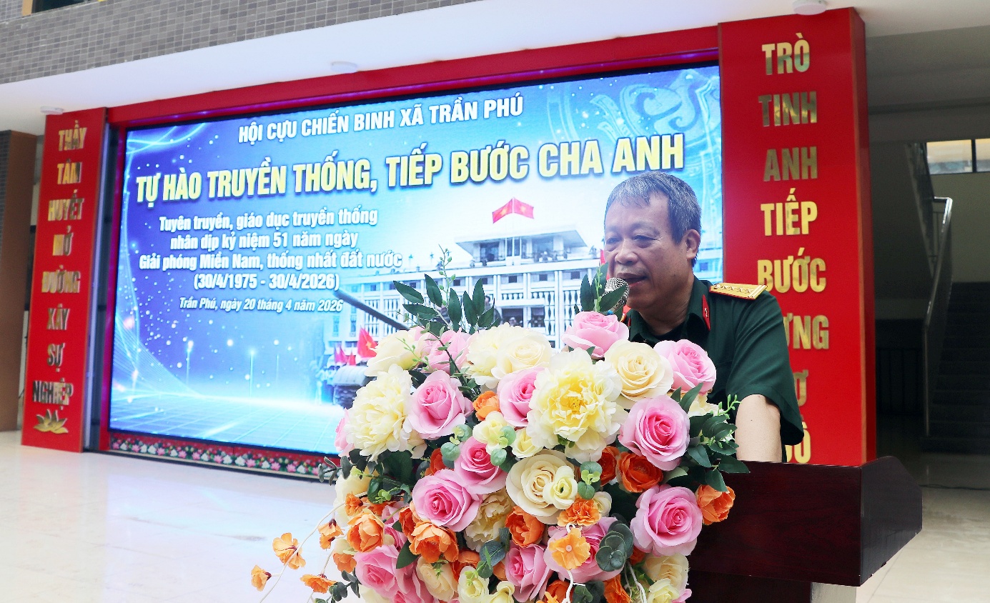 A person standing behind a podium with a bouquet of flowers  AI-generated content may be incorrect.