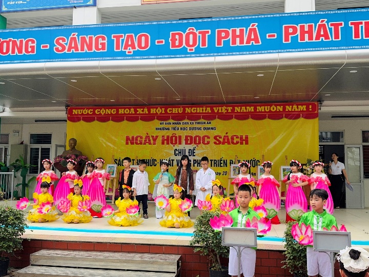 A group of children on a stage  AI-generated content may be incorrect.