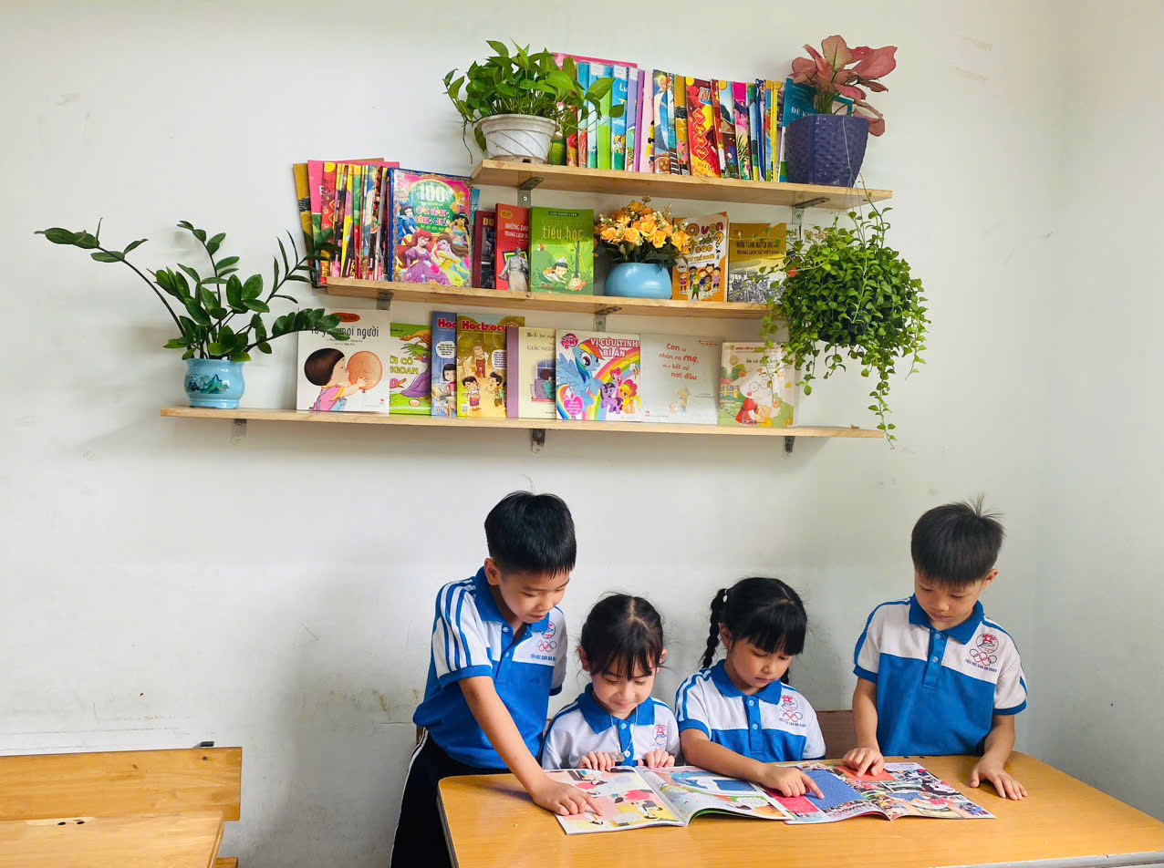 A group of children reading a book  AI-generated content may be incorrect.