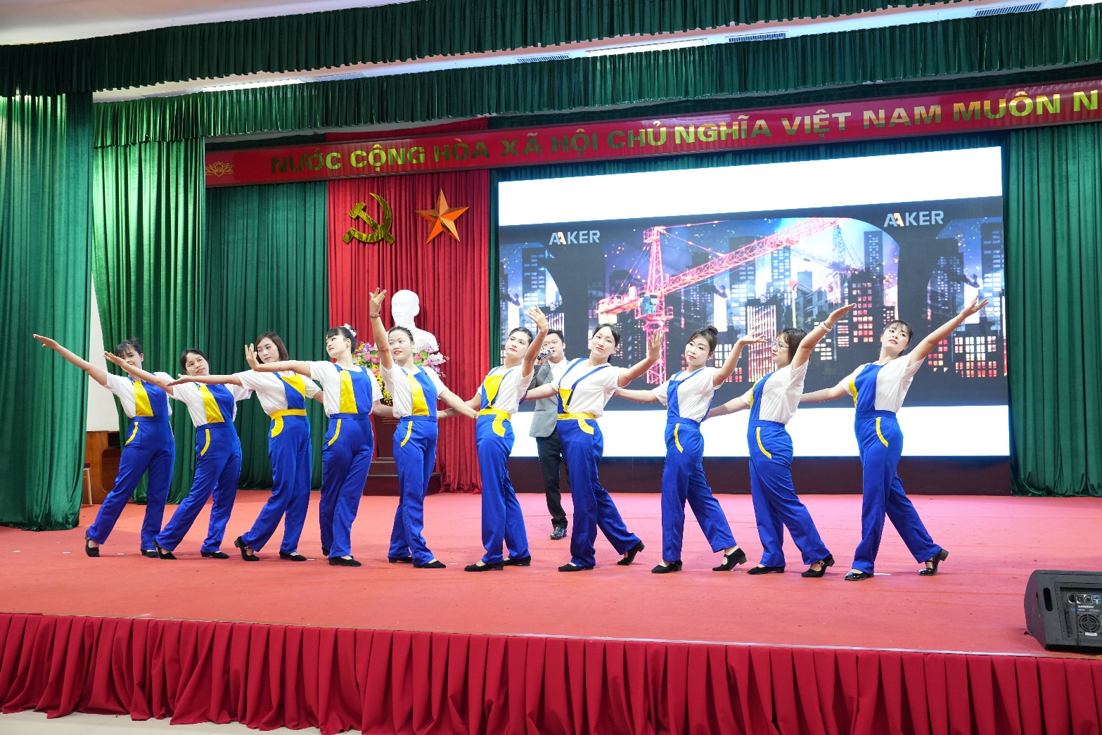 A group of people performing on a stage  AI-generated content may be incorrect.