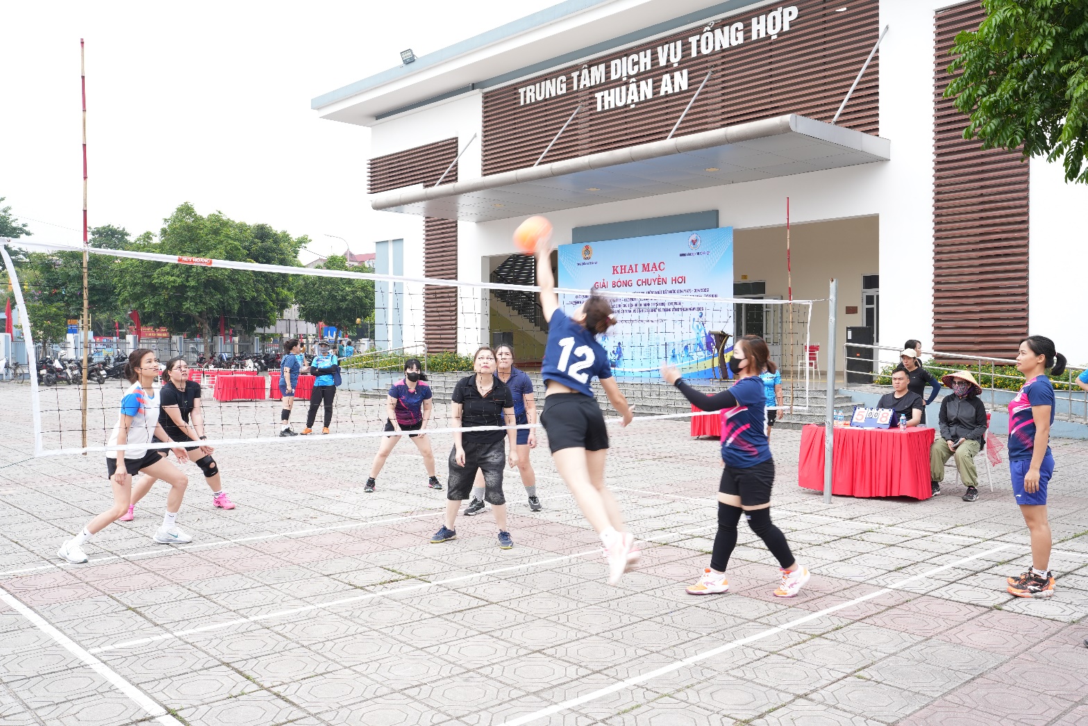 A group of people playing volleyball  AI-generated content may be incorrect.