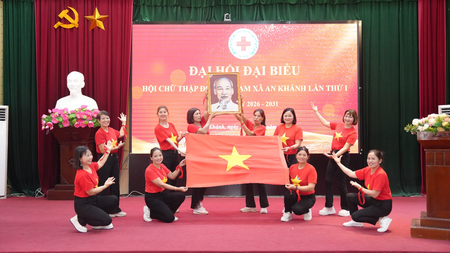 A group of people on a stage holding a flag  AI-generated content may be incorrect.