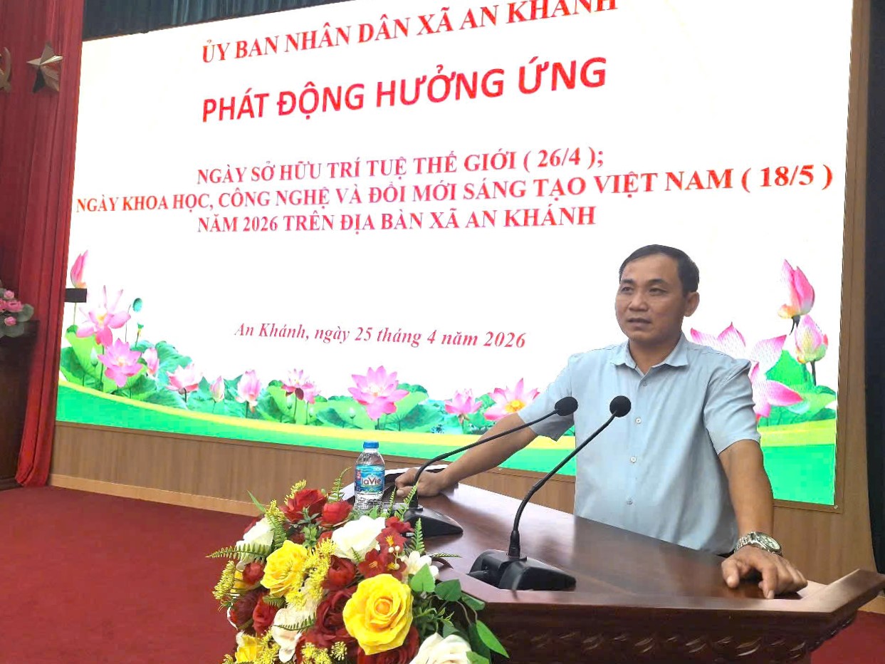 A person standing at a podium with microphones  AI-generated content may be incorrect.