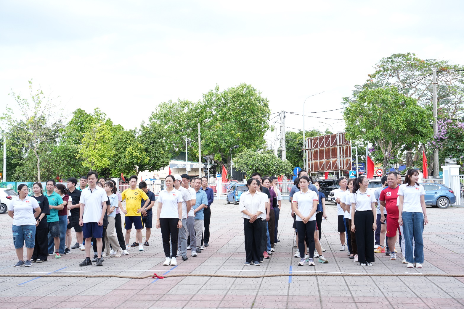 A group of people standing on a sidewalk  AI-generated content may be incorrect.