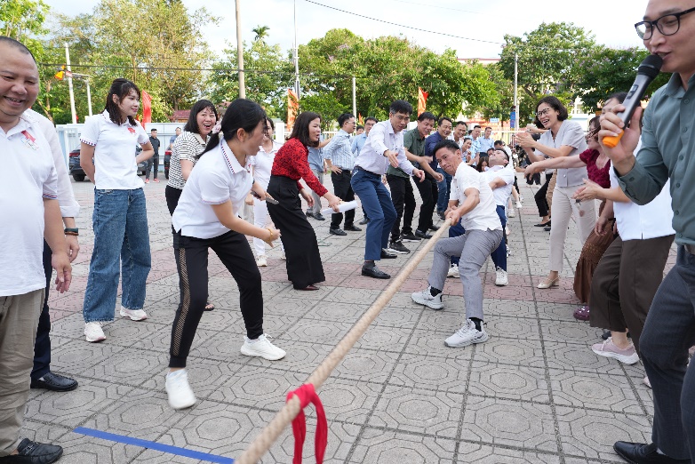 A group of people playing tug of war  AI-generated content may be incorrect.
