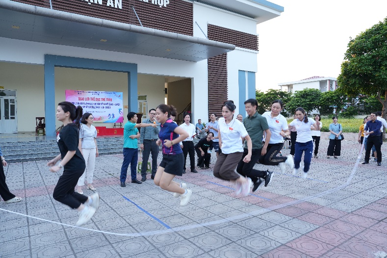 A group of people jumping on a rope  AI-generated content may be incorrect.